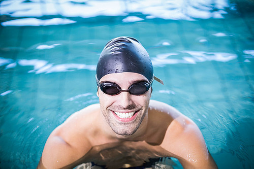 Man wearing swimming goggles in the swimming pool