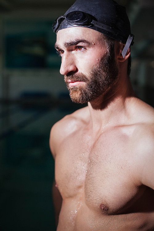 Serious man looking at something at the pool