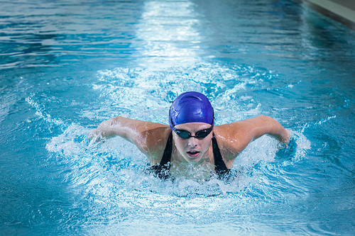 Fit woman swimming in the pool