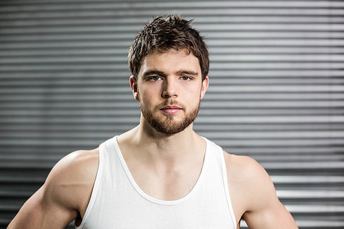 Portrait of fit man at crossfit gym