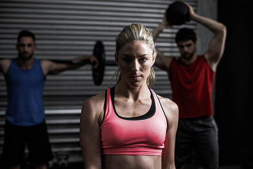 Portrait of fit woman at crossfit gym
