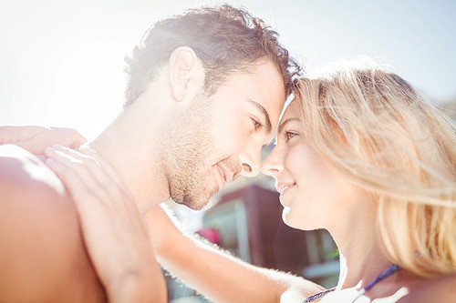 Cute couple hugging by the pool