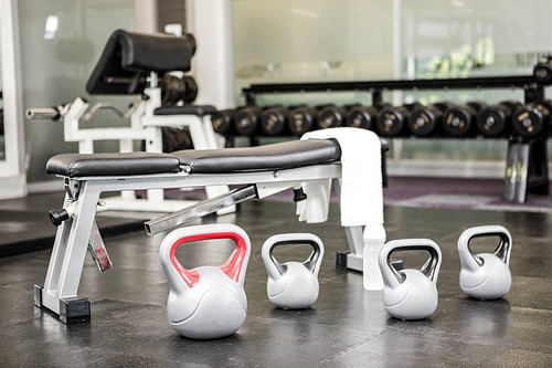 Bench and kettlebells in the gym