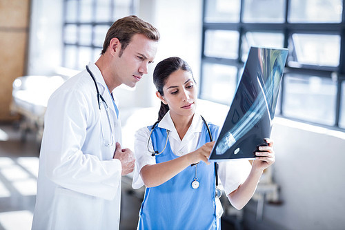 Medical team looking at x-ray together at hospital