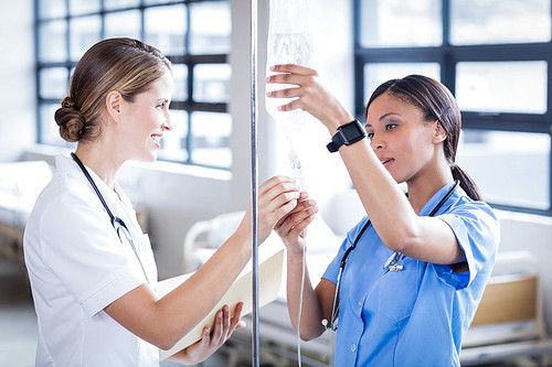 Medical team preparing an IV drip at the hospital