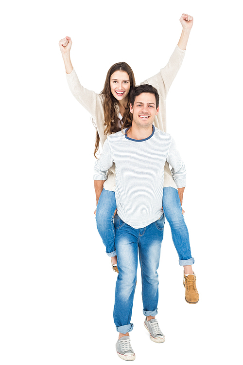 Man giving piggy back to his girlfriend on white background