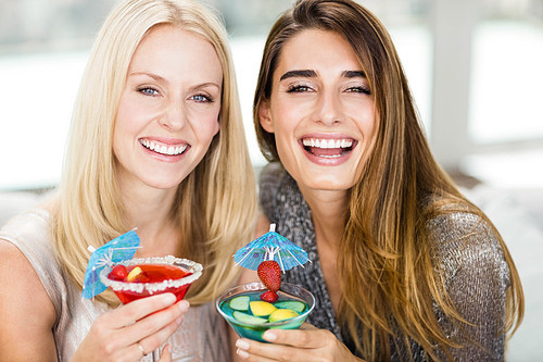 Portrait of beautiful women smiling and having mocktail