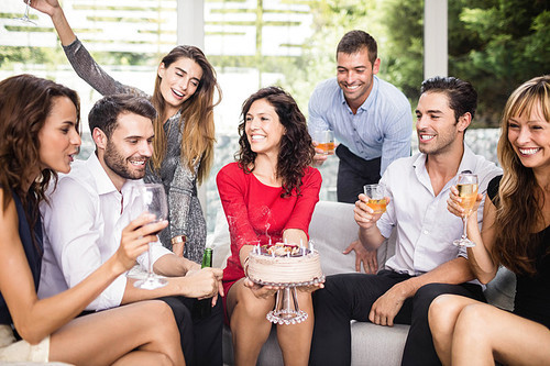Woman celebrating her birthday with group of friends