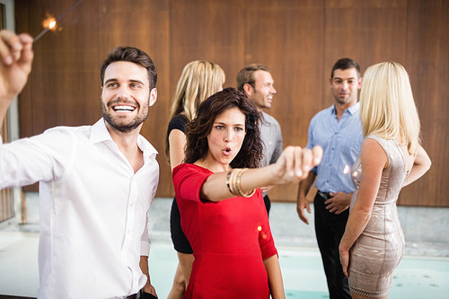 Group of young friends dancing at the party