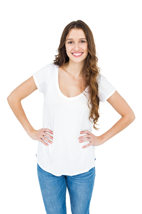 Smiling woman with hands on hips on white background