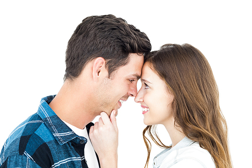 Couple standing head against head and holding chin on white background