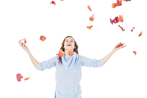 Happy woman throwing leaves on white background