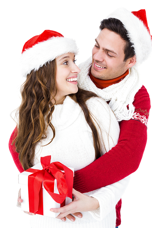 Festive couple holding christmas gift on white screen