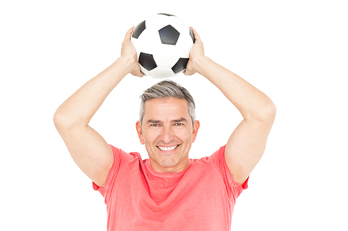 Smiling man holding football on white background