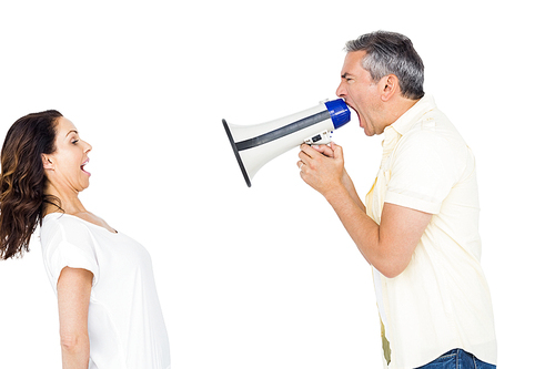 Couple shouting with man holding megaphone on white background