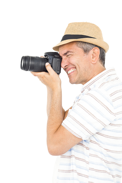 Handsome man taking picture on white background