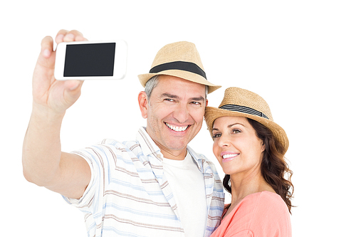 Cute couple taking selfie over white background