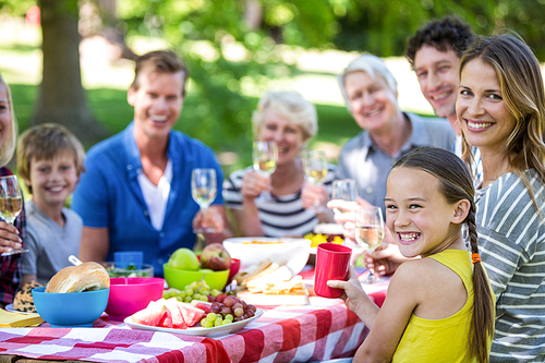 Family and friends having a picnic in a garden