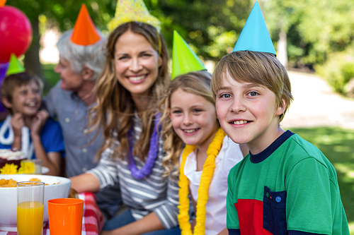 Happy family celebrating a birthday in the park