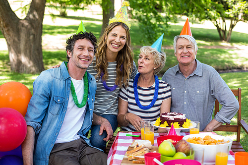 Happy family celebrating a birthday in the park