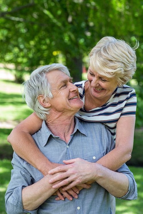 Senior couple embracing in park