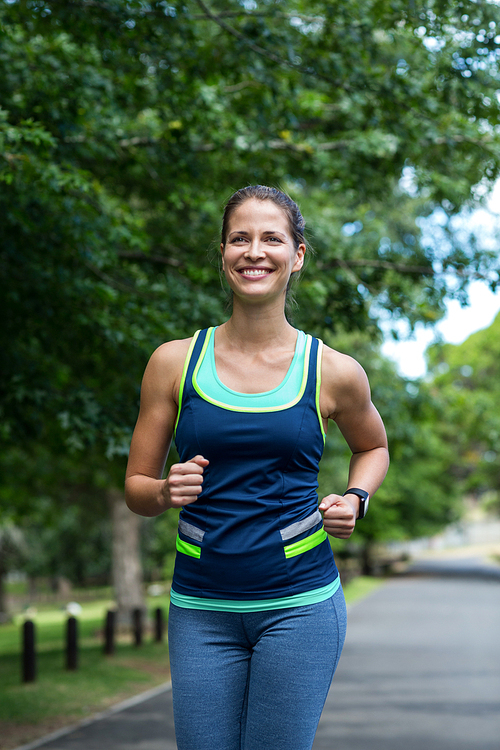 Marathon female athlete running in park