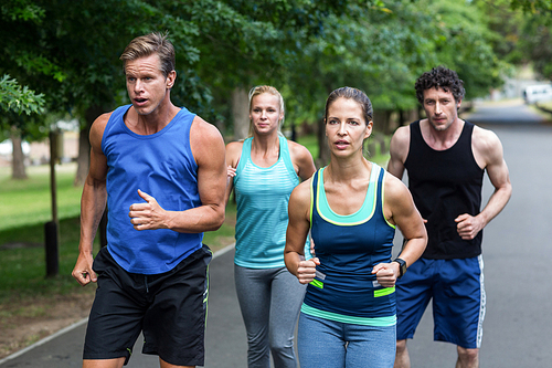 Marathon athletes running in park