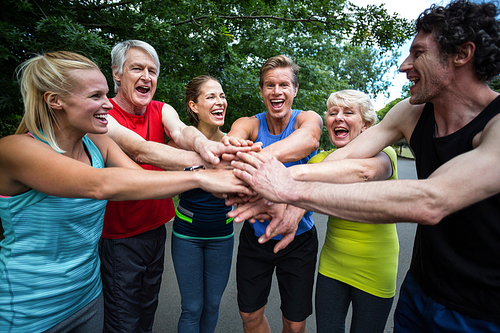 Marathon athlete making motivation gesture in park