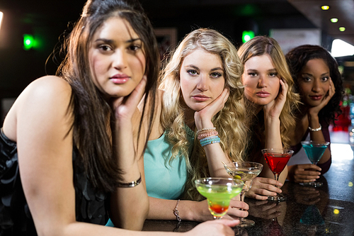 Portrait of friends having a drink in a bar
