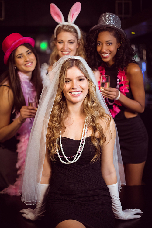 Friends celebrating bachelorette party in a nightclub