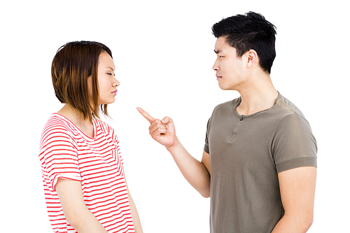 Young couple into an argument on white background