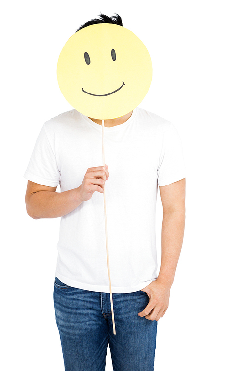 Man holding smiley face on white background