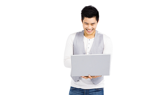 Young man using laptop on white background