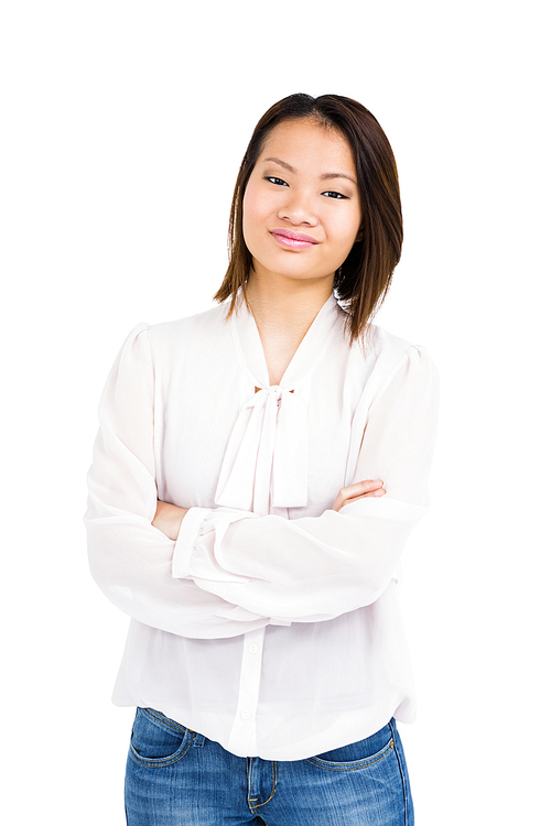 Pretty young woman standing with arms crossed on white background