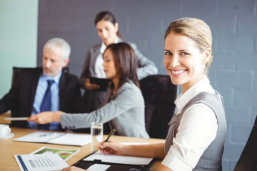 Confident businesswoman in business meeting  in conference room at office