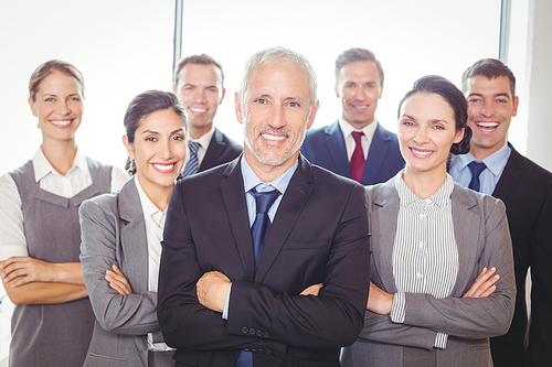 Team of businesspeople posing together in the office