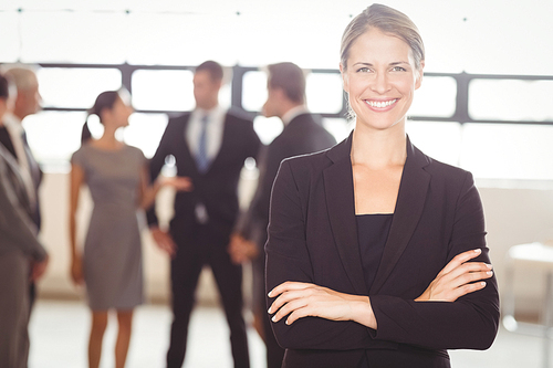 Portrait of attractive businesswoman smiling at camera