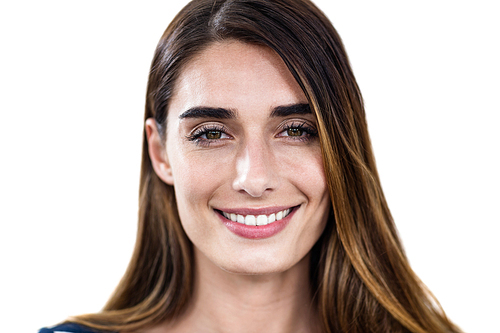 Close-up portrait of smiling young woman standing on white background