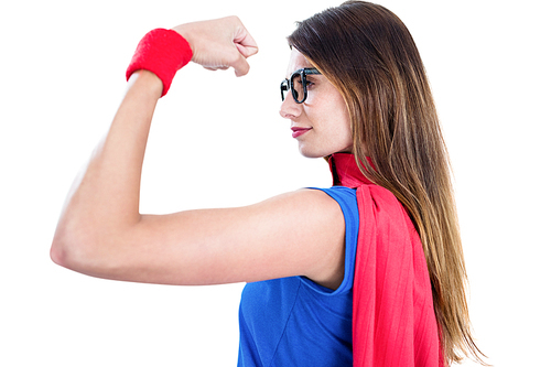 Woman in superhero costume while flexing muscles on white background