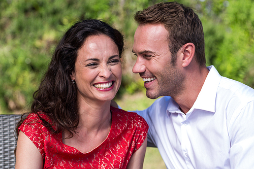Close-up of smiling happy couple in lawn