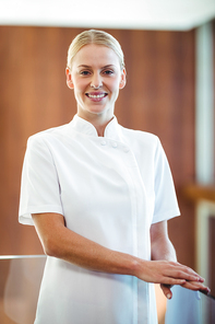 Portrait of smiling masseuse at spa