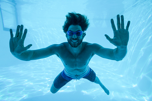 Man swimming under swimming pool at resort