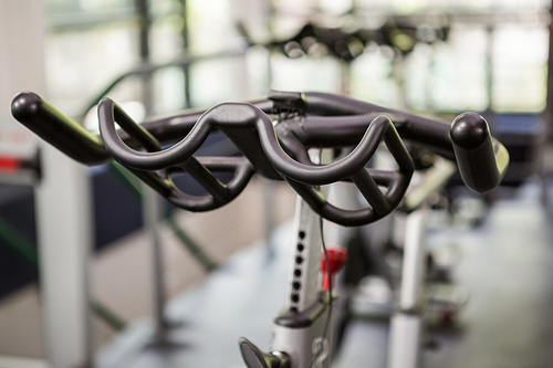 Close-up of exercise bike handlebar in spinning class
