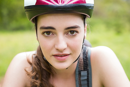 Portrait of woman with helmet in the countryside