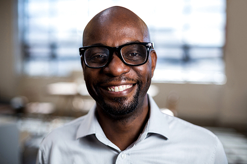 Man smiling at camera in the office