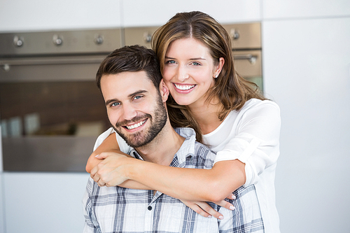 Close-up portrait of happy young couple at home