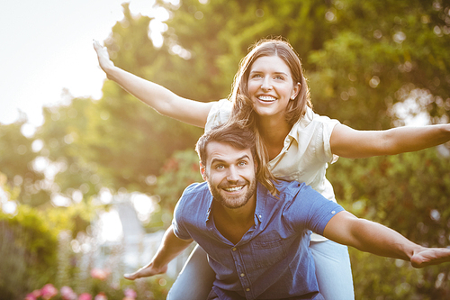 Smiling couple having fun at park