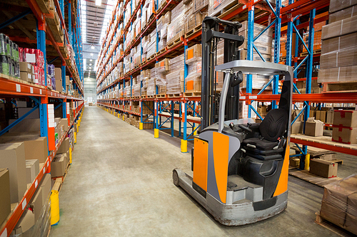 View of pallet truck and goods tidy in a warehouse