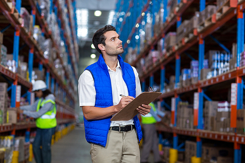 Worker controlling stocks in warehouse