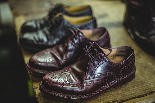 Pair of leather shoes in workshop
